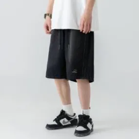 Short en denim délavé pour homme avec bande latérale brodée
