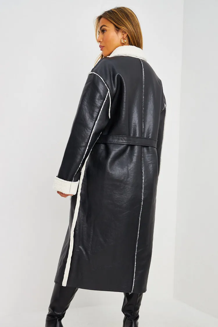 Veste longue noire à empiècement fourrure